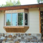 Bay window on a house with a stone wastecoat