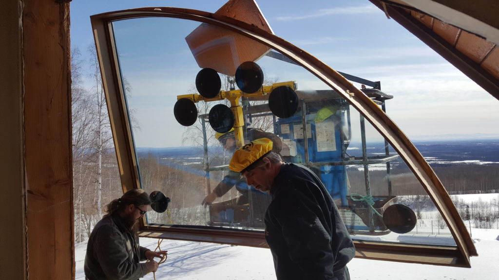 ABC crew installing window with genie lift