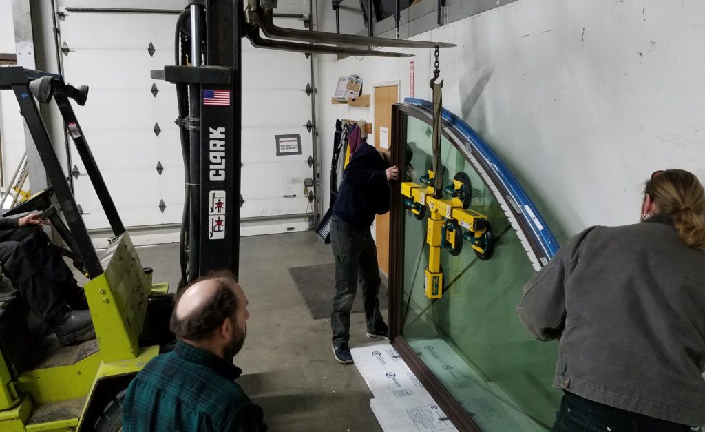 ABC crew inspects and prepares unique window for installation