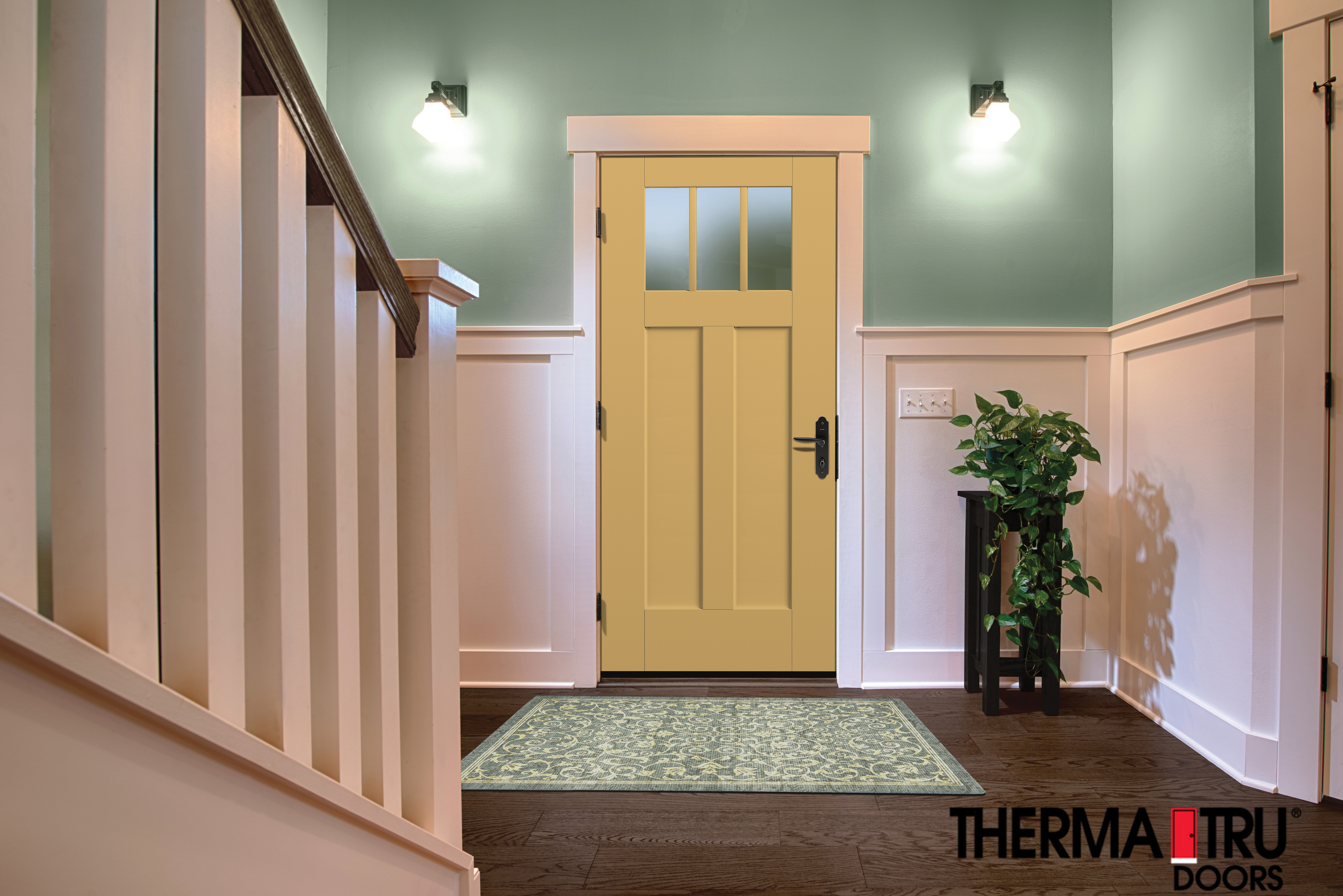 Bright entry way with yellow door and mint green walls